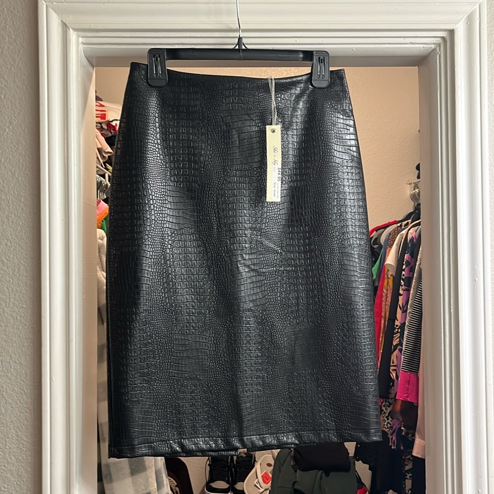New with tags black leather skirt size small fits more like a medium